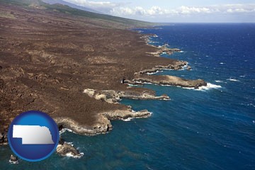 an aerial photograph of a Hawaiian shoreline - with Nebraska icon